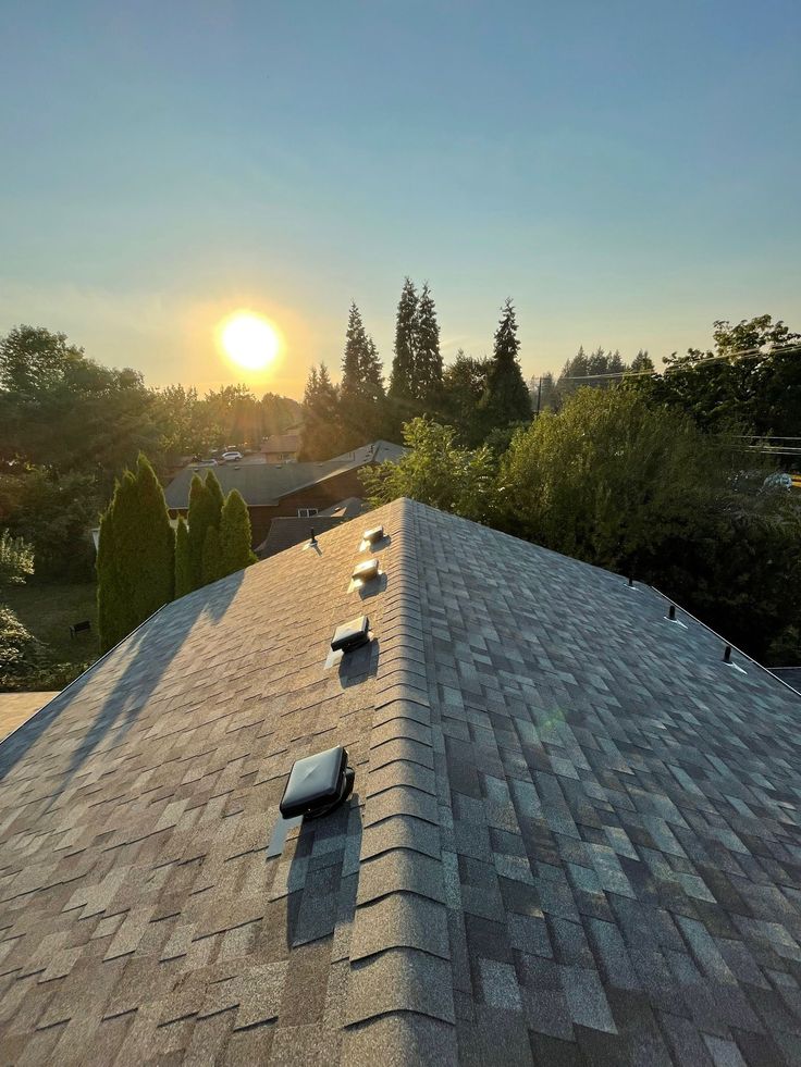 Freshly installed shingle roof at Alaskan sunset